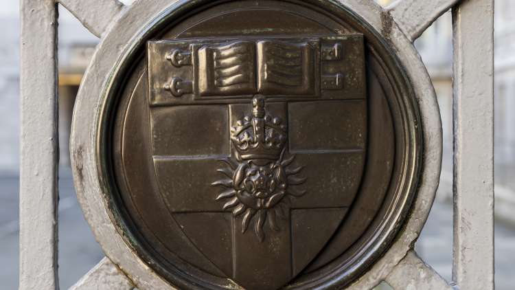 Railing detail of the University of London shield outside Senate House